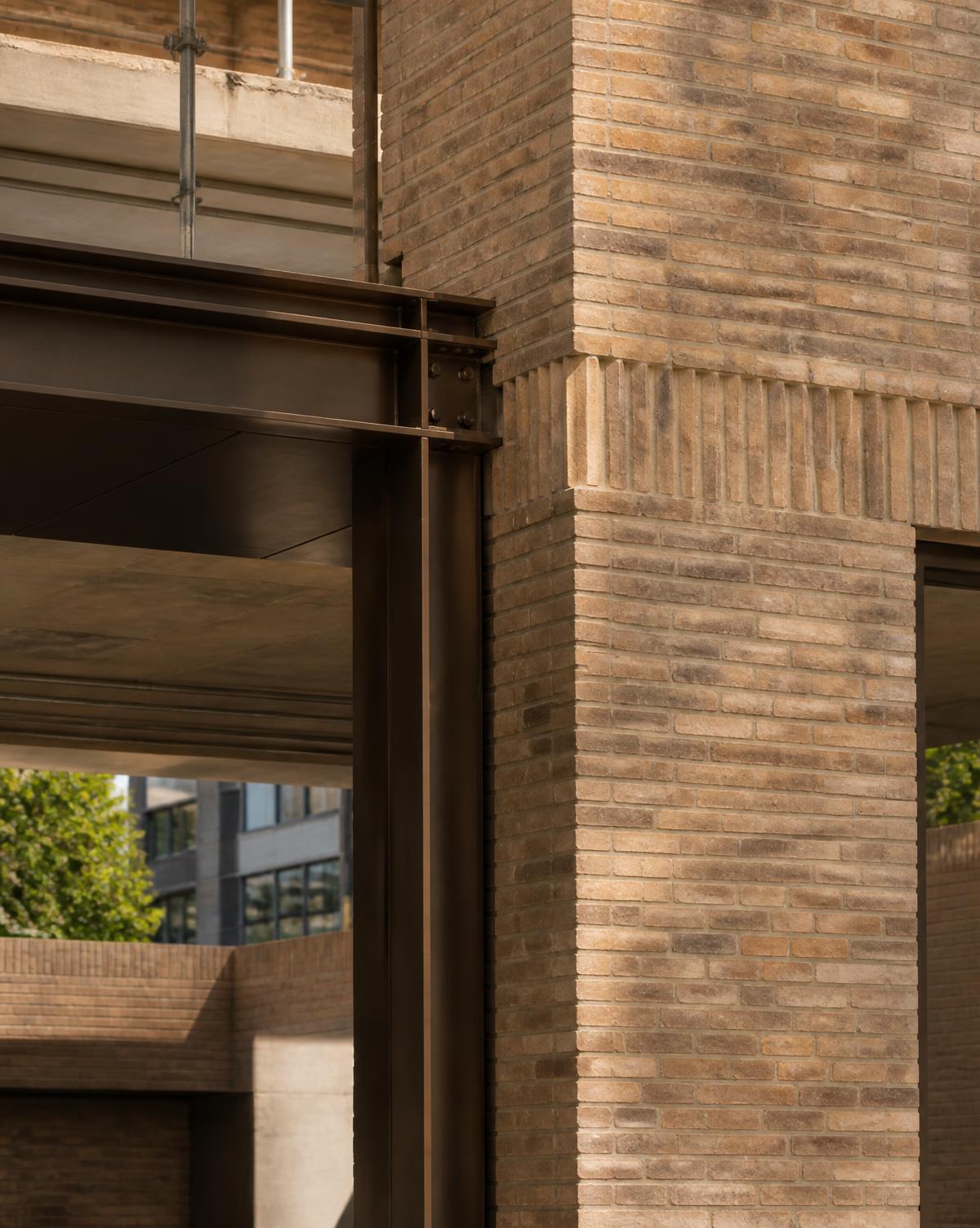 Architectural detail of brickwork meeting a steel beam on a London construction project